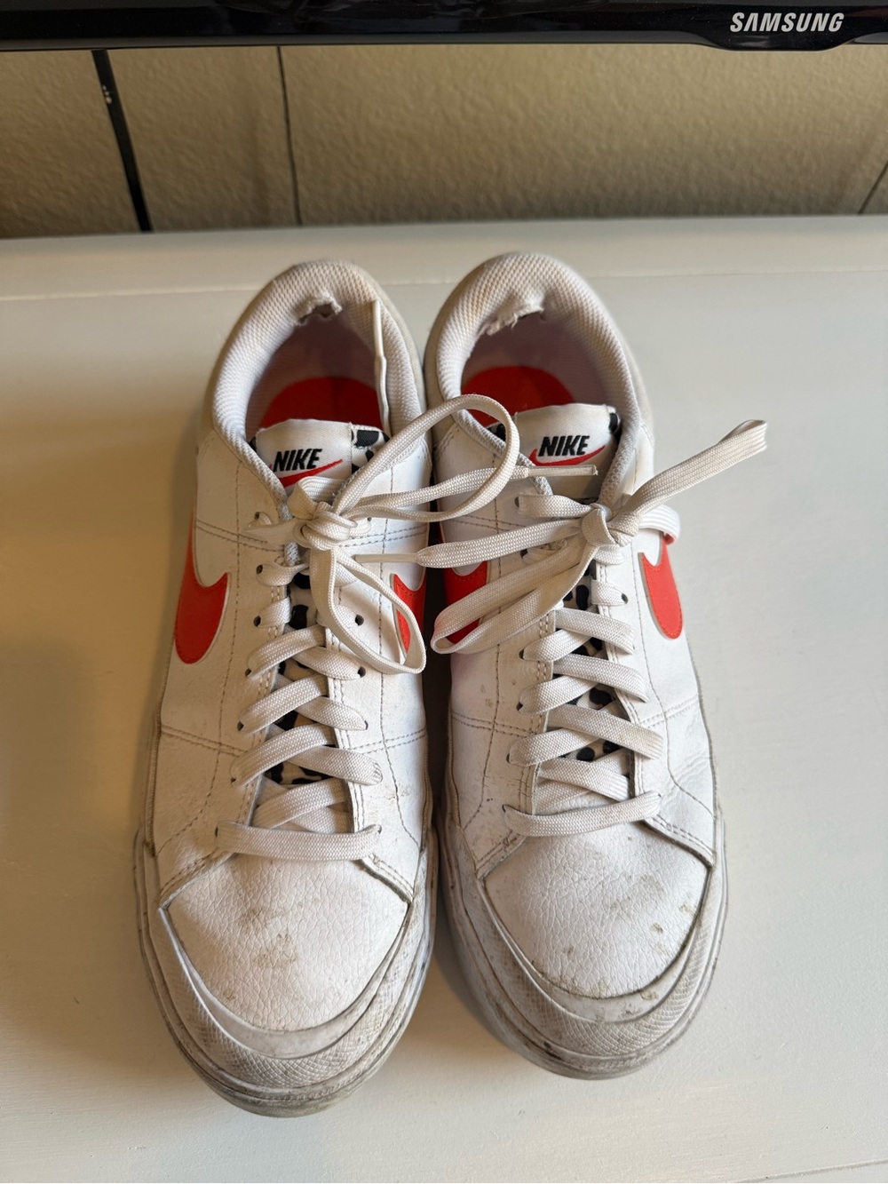 Nike  White Sneakers with orange Swoosh